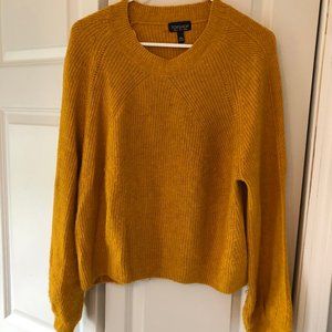 yellow sweater
